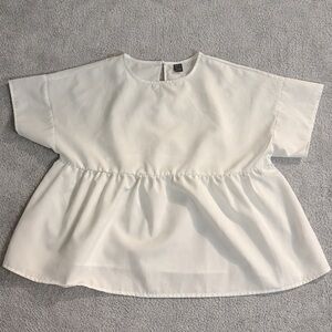 SHEIN Woman’s casual solid color batwing sleeve shirt.